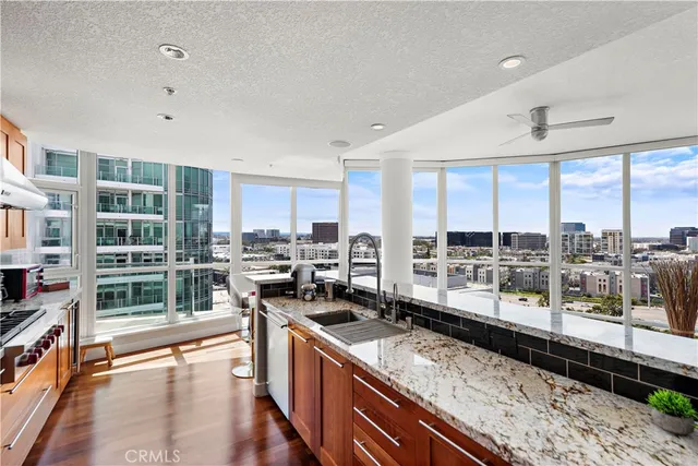 a living room with furniture flat screen tv and window