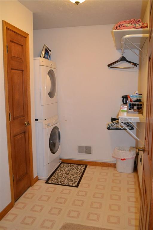 150 Adams Road Kittanning, PA 16201 - Photo 17 of 25 2nd floor laundry room with stackable washer and dryer and hidden wall mount foldout ironing board. Set up for both gas or electric. Both adjacent bathroom's linen closets are accessible from the laundry room.