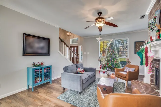 a living room with furniture a chandelier and a window
