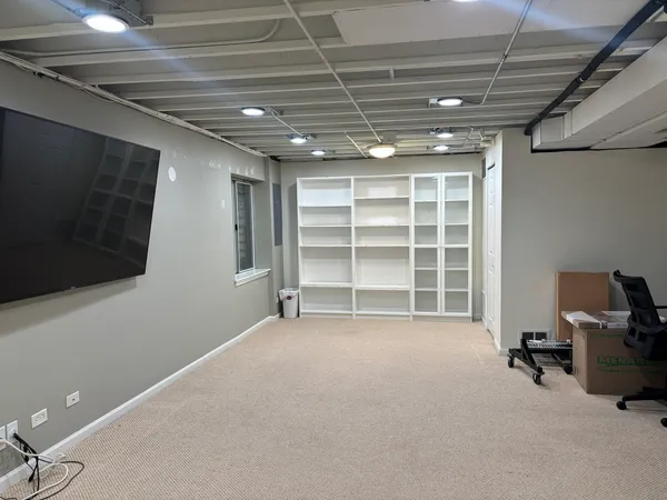a view of an empty room with a window