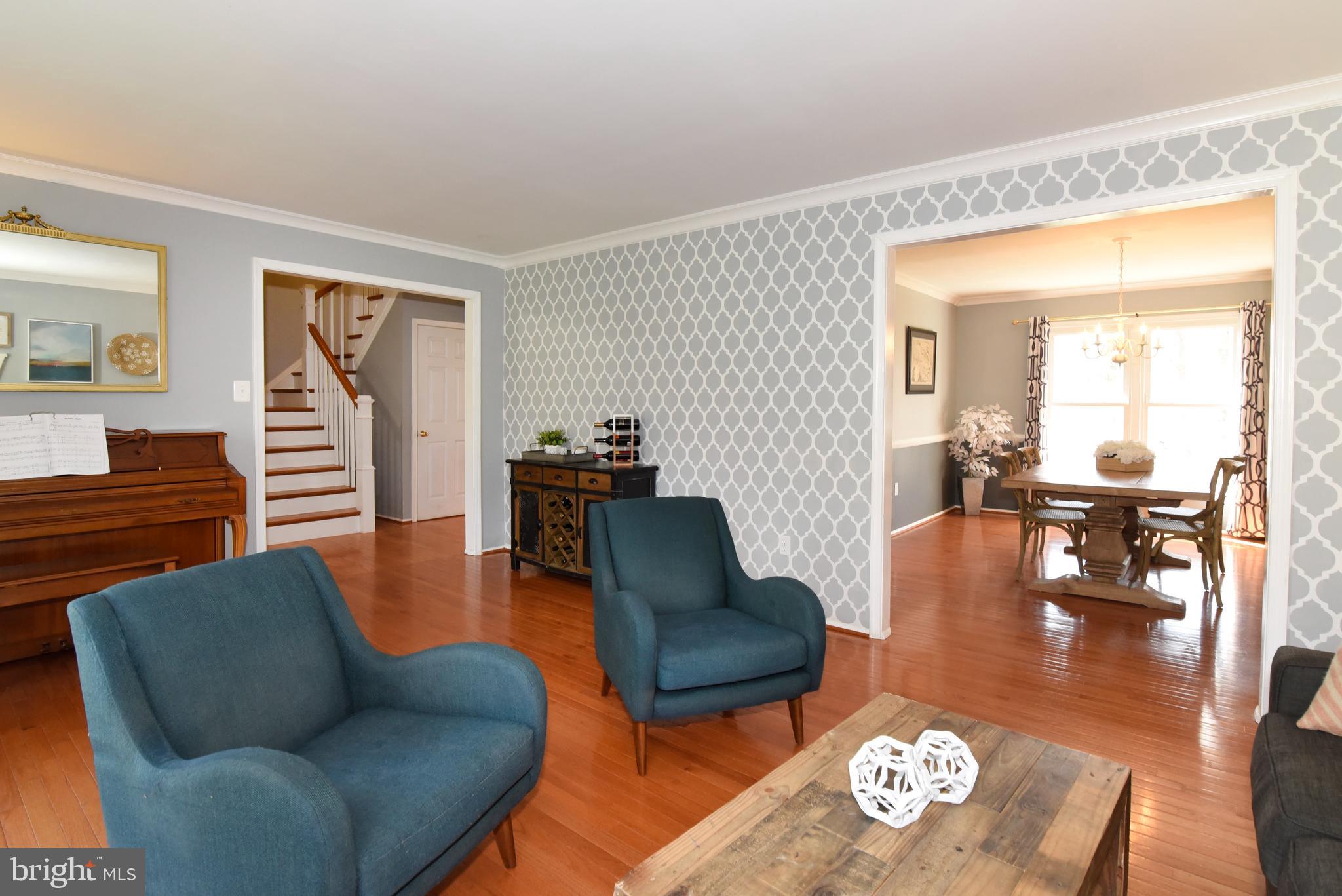 View of Living Room, Dining Room, Foyer.