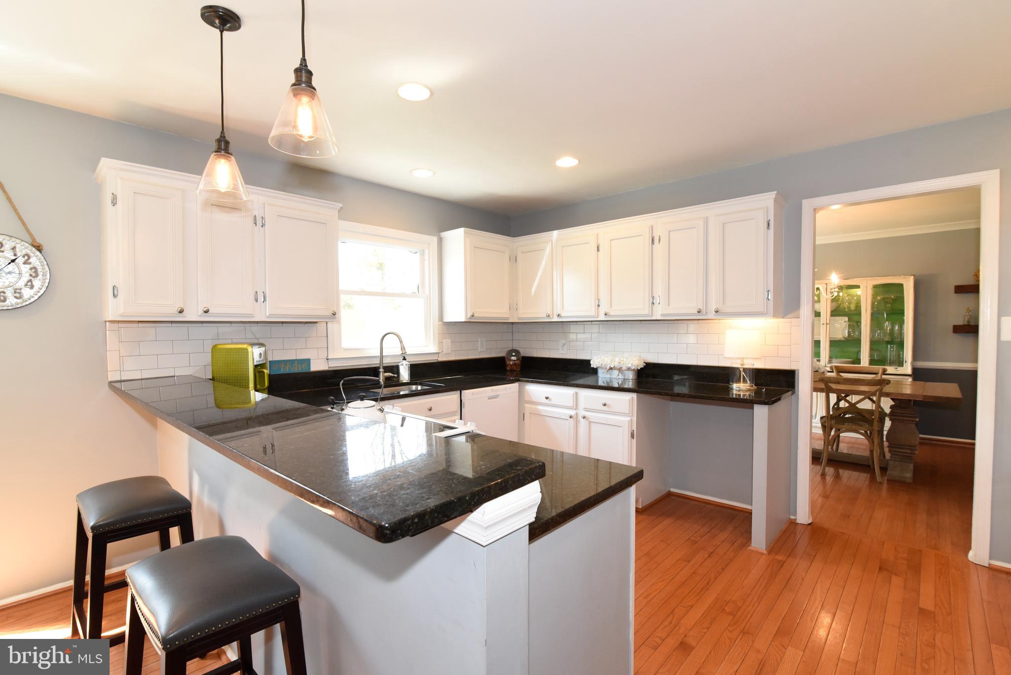 White Kitchen with Breakfast Bar.