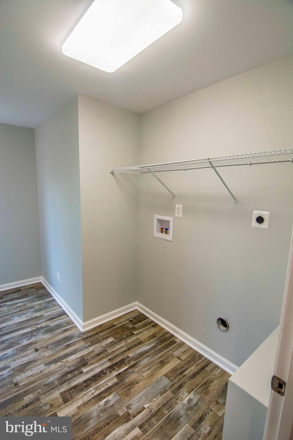 181 Sifer Road Front Royal, VA 22630 - Photo 40 of 46 Upstairs Laundry Room with shelving & Linen Closet