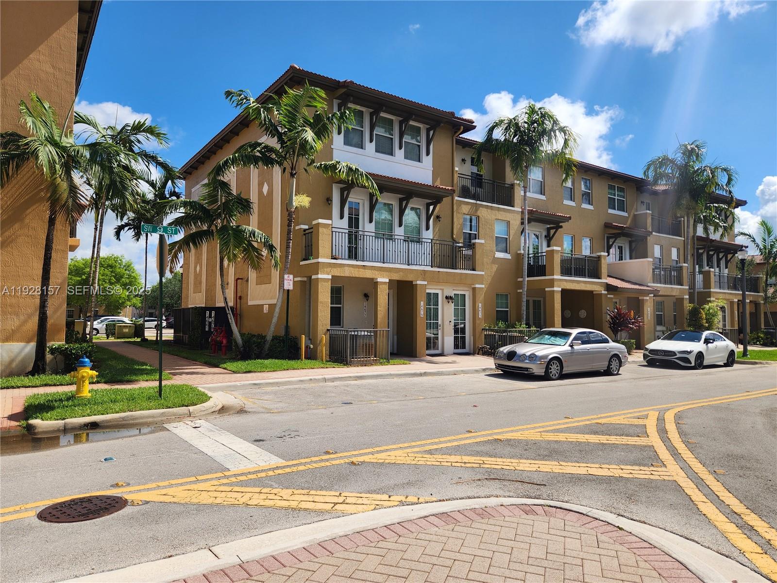 14677 Southwest 9th Street, Unit 1802 Pembroke Pines, FL 33027 - Photo 13 of 18 a view of a building with a street