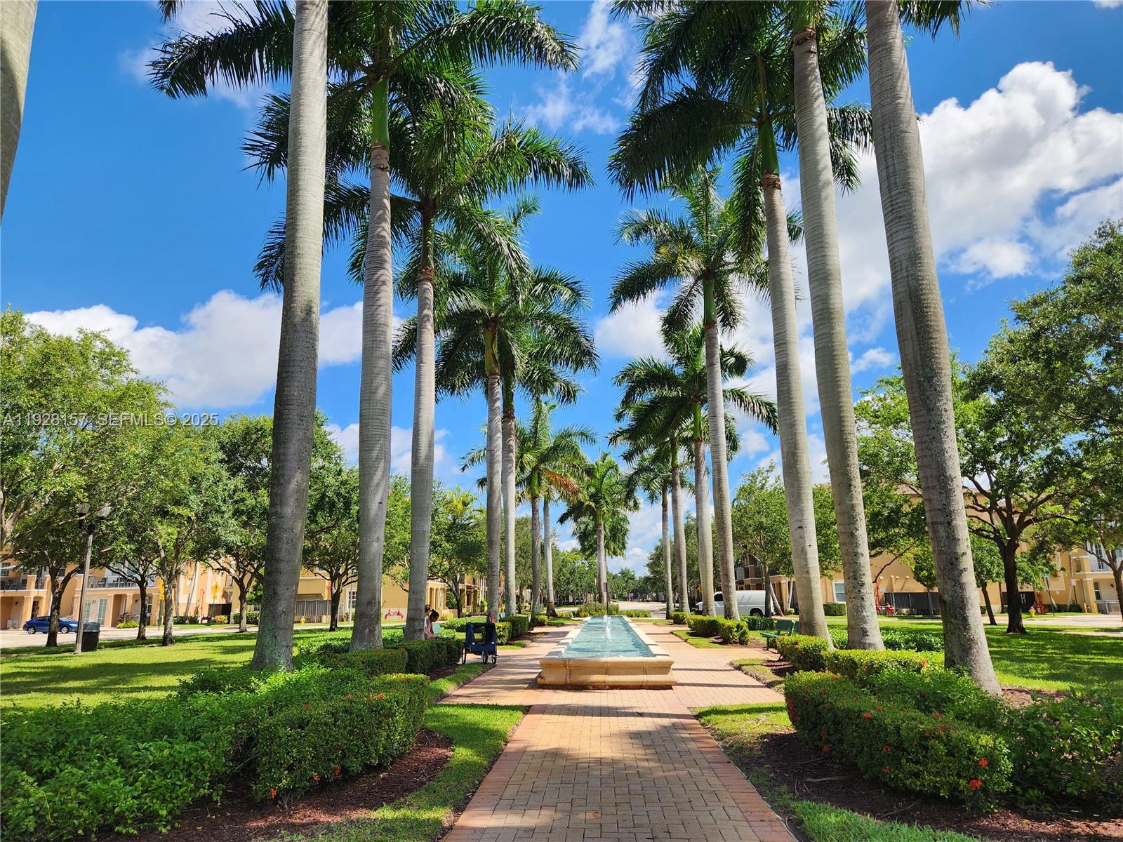 14677 Southwest 9th Street, Unit 1802 Pembroke Pines, FL 33027 - Photo 3 of 18 a view of a yard with palm trees
