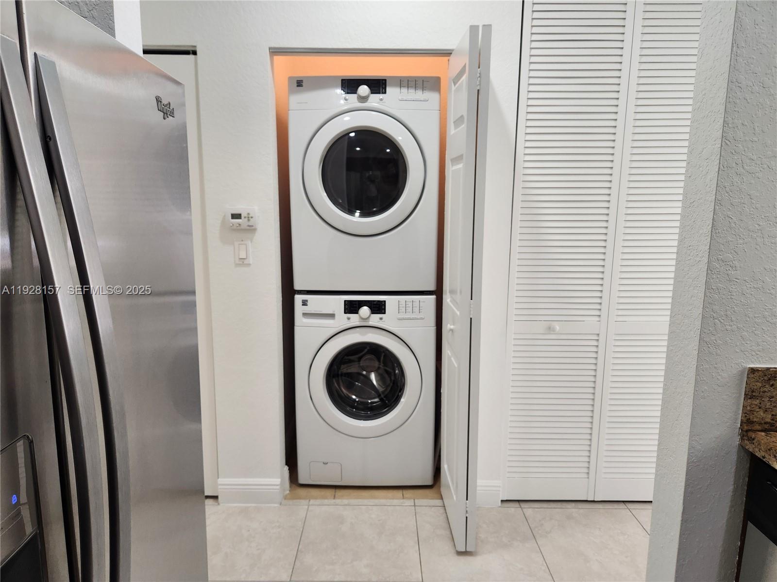 14677 Southwest 9th Street, Unit 1802 Pembroke Pines, FL 33027 - Photo 8 of 18 a utility room with dryer and washer