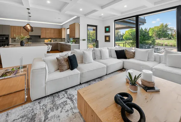 a living room with a bed and a dresser