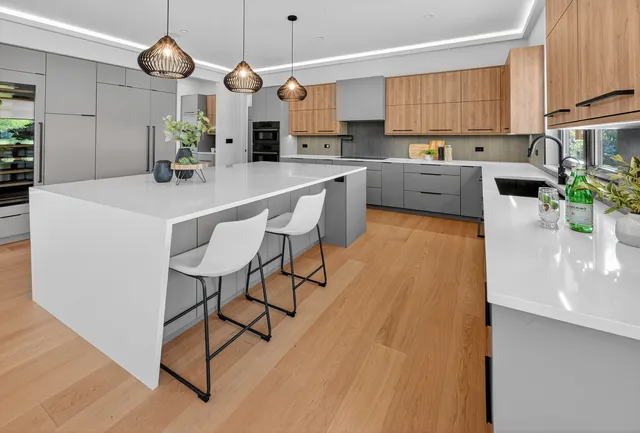 a living room with a bed and a dresser