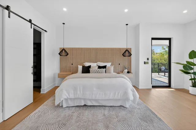 a large kitchen with stainless steel appliances a large counter top