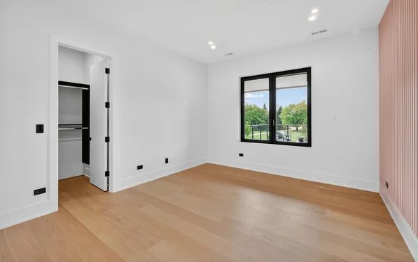 a large kitchen with stainless steel appliances a large counter top