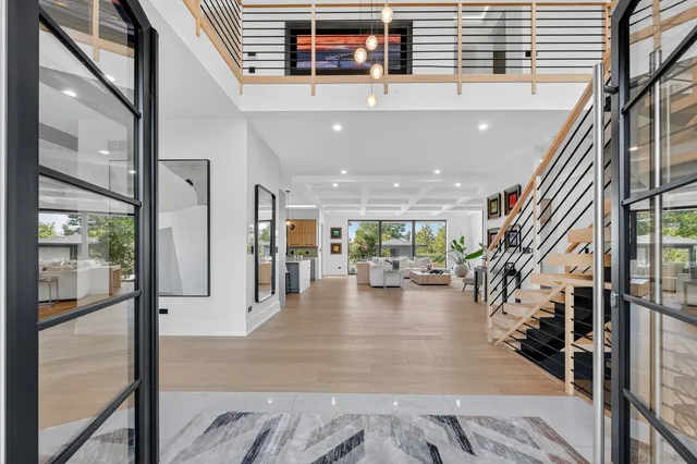 a view of entryway and hall with wooden floor
