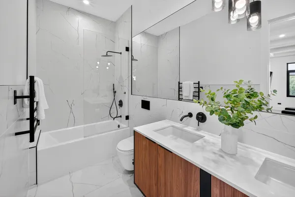 a bathroom with a bathtub and shower