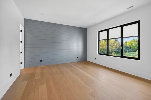 a room with gym equipment and a large mirror
