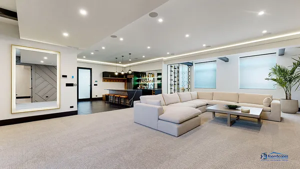 a swimming pool view with a seating space and a garden view