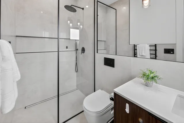 a living room with furniture kitchen and a chandelier
