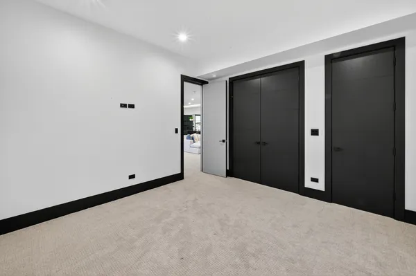 an aerial view of residential house with outdoor space and trees all around