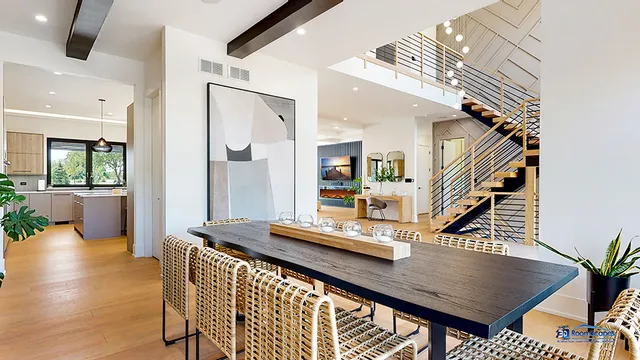 a living room with furniture a flat screen tv and a large window