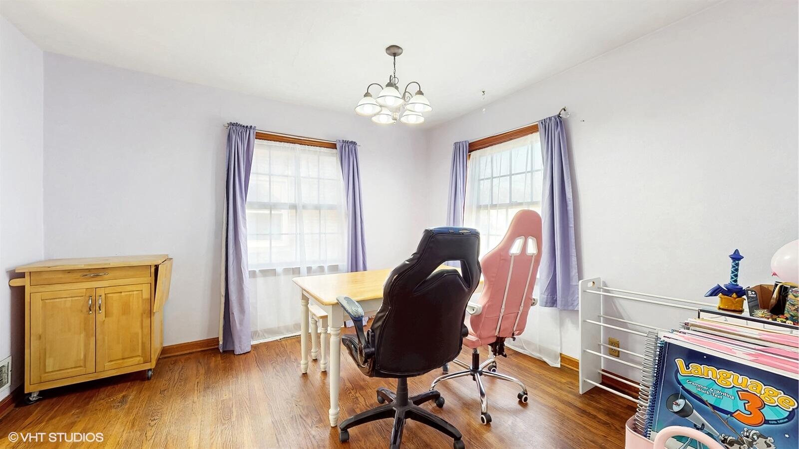 508 173rd Street Hammond, IN 46324 - Photo 12 of 61 a view of a workspace with furniture and a window