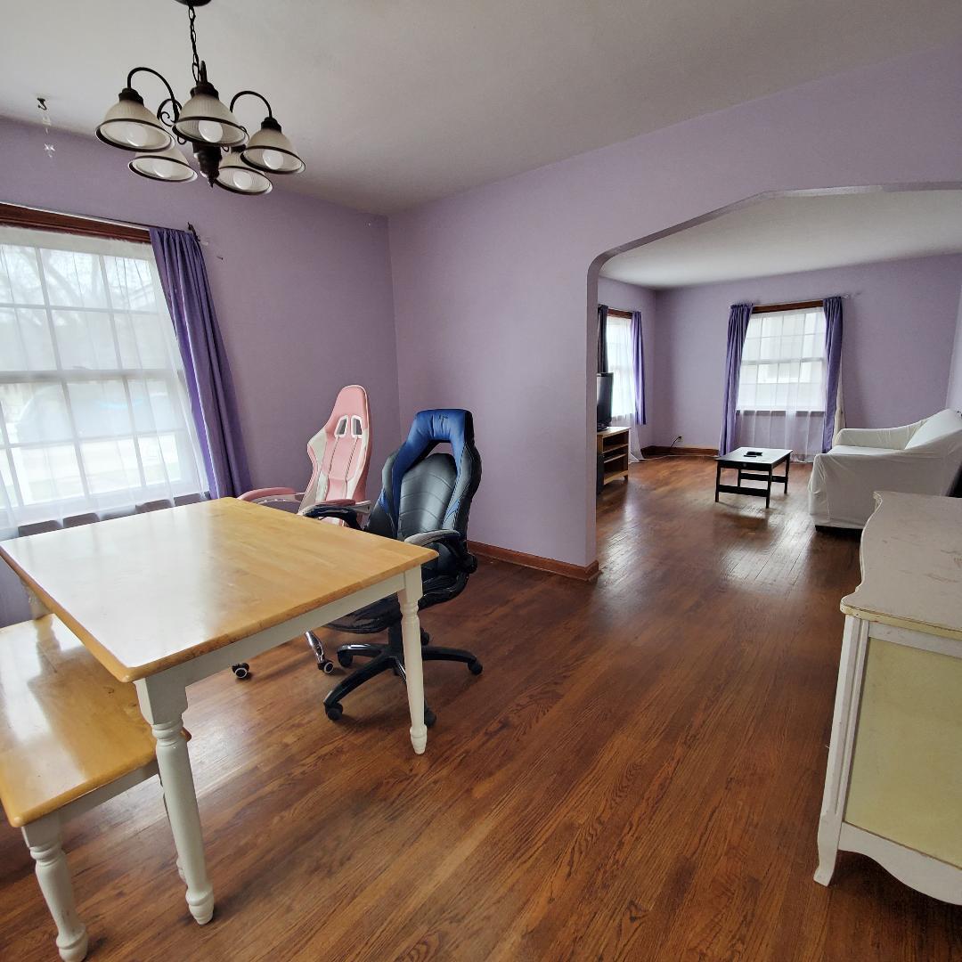508 173rd Street Hammond, IN 46324 - Photo 13 of 61 a view of a dining room with furniture wooden floor and chandelier