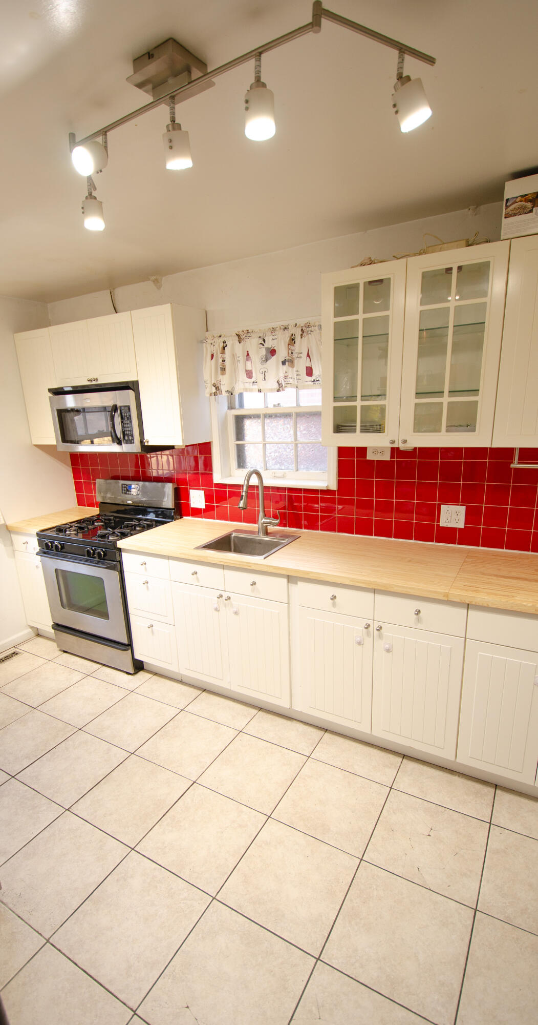 508 173rd Street Hammond, IN 46324 - Photo 14 of 61 a living room with granite countertop lots of white cabinets and a chandelier