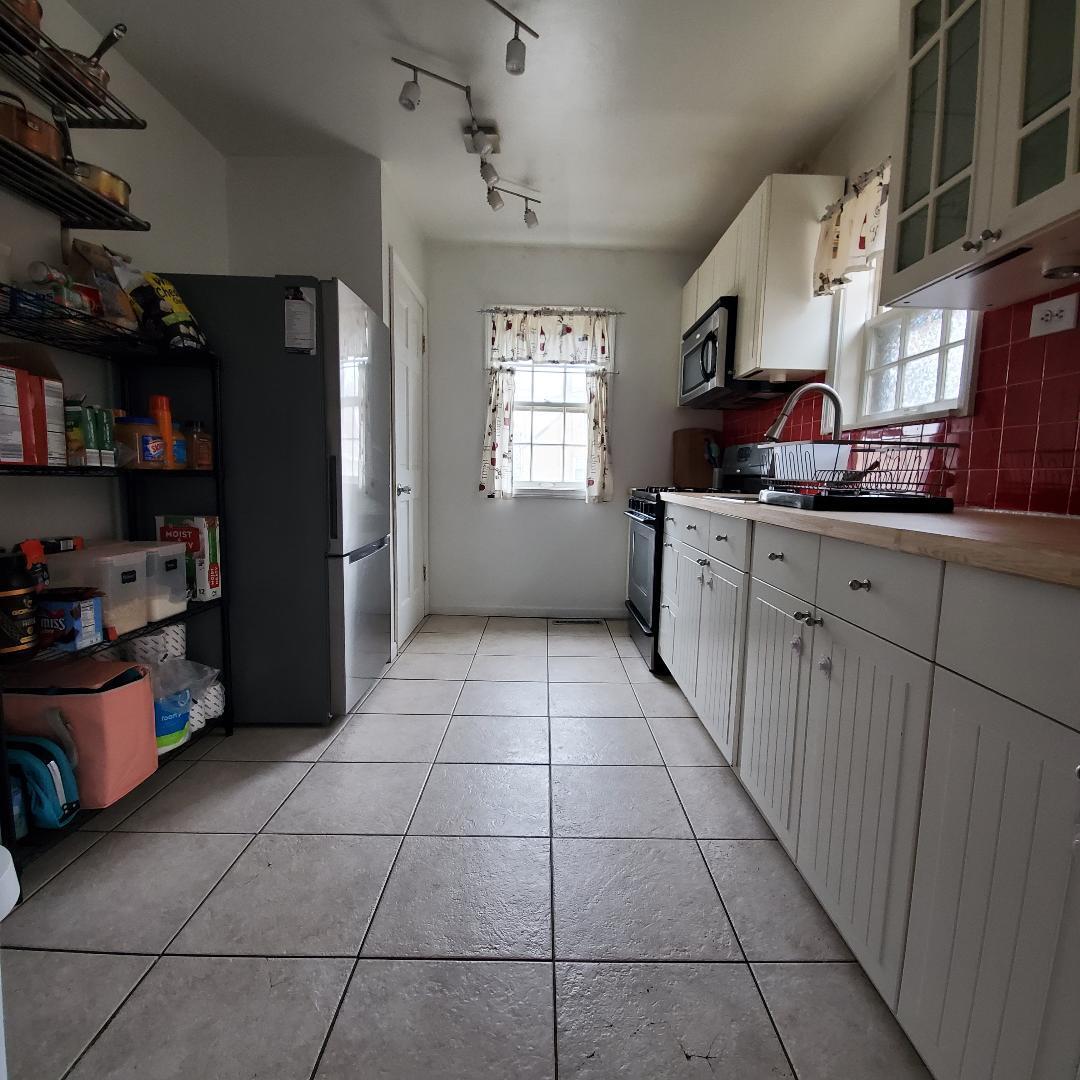 508 173rd Street Hammond, IN 46324 - Photo 16 of 61 a kitchen with stainless steel appliances granite countertop a refrigerator and a sink