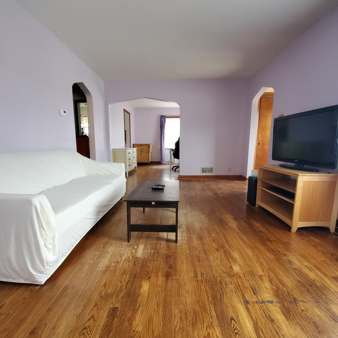 508 173rd Street Hammond, IN 46324 - Photo 7 of 61 a bedroom with a bed and wooden floor