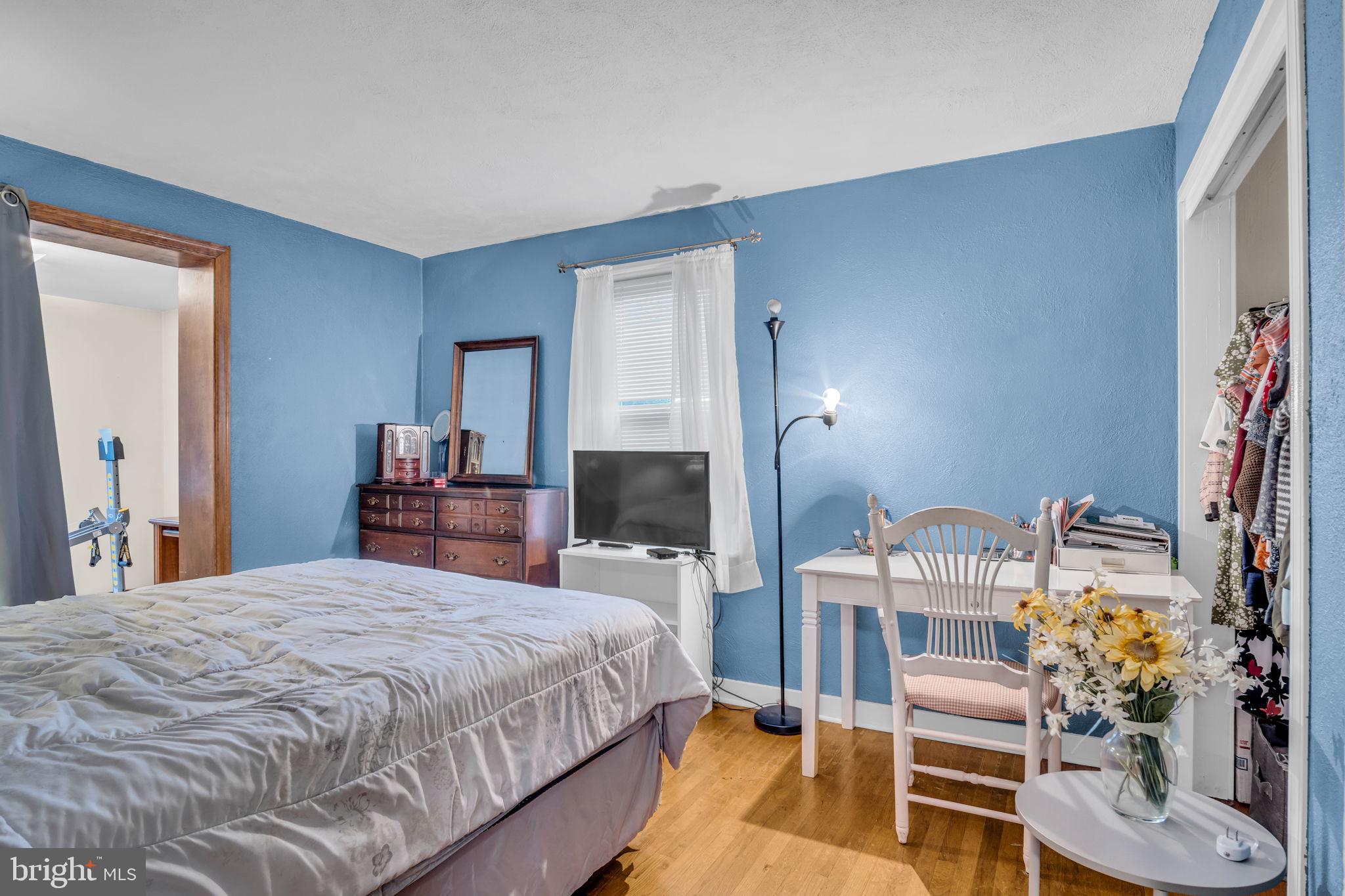 1036 Smith Hill Road York, PA 17408 - Photo 11 of 31 a bedroom with a bed and a flat tv screen on dresser