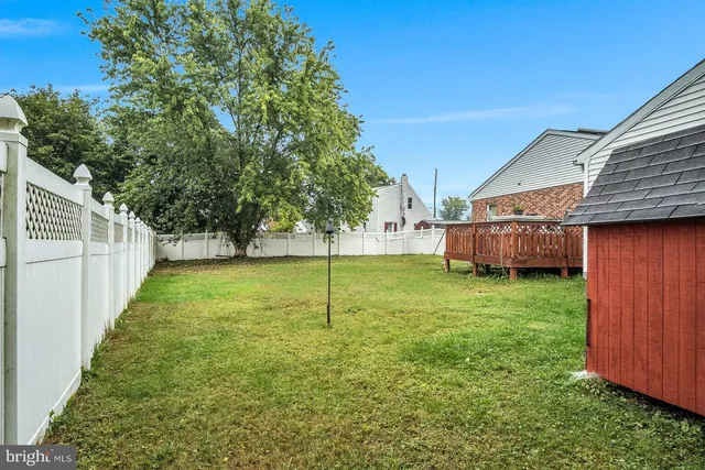 a view of backyard with green space