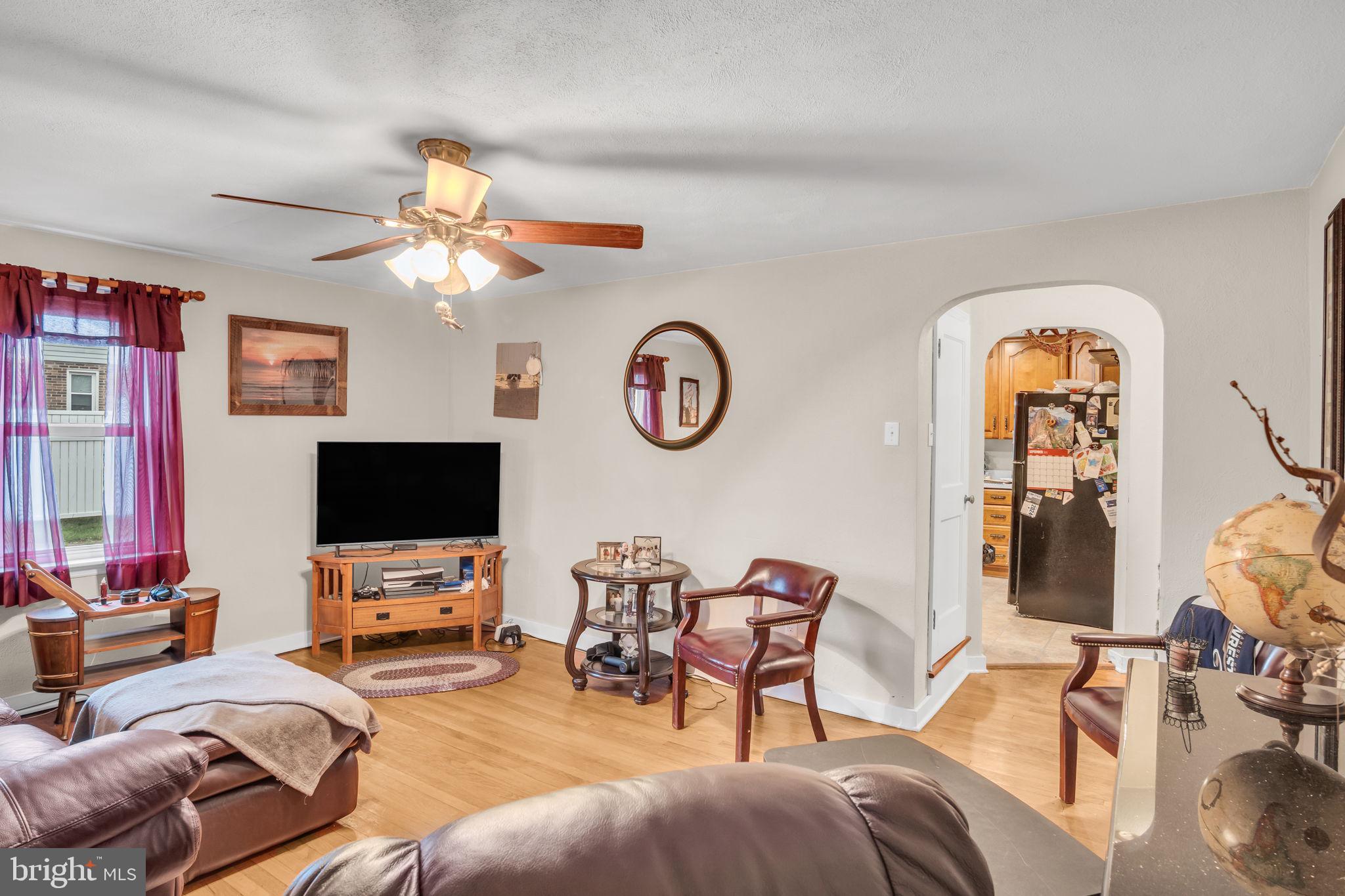 1036 Smith Hill Road York, PA 17408 - Photo 6 of 31 a living room with furniture a flat screen tv and a window