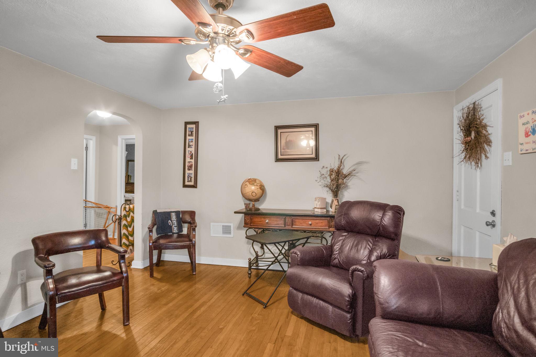 1036 Smith Hill Road York, PA 17408 - Photo 7 of 31 a living room with furniture a ceiling fan and a rug