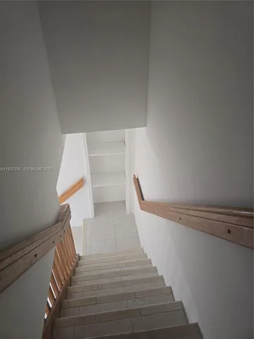 a bathroom with a sink toilet and a mirror