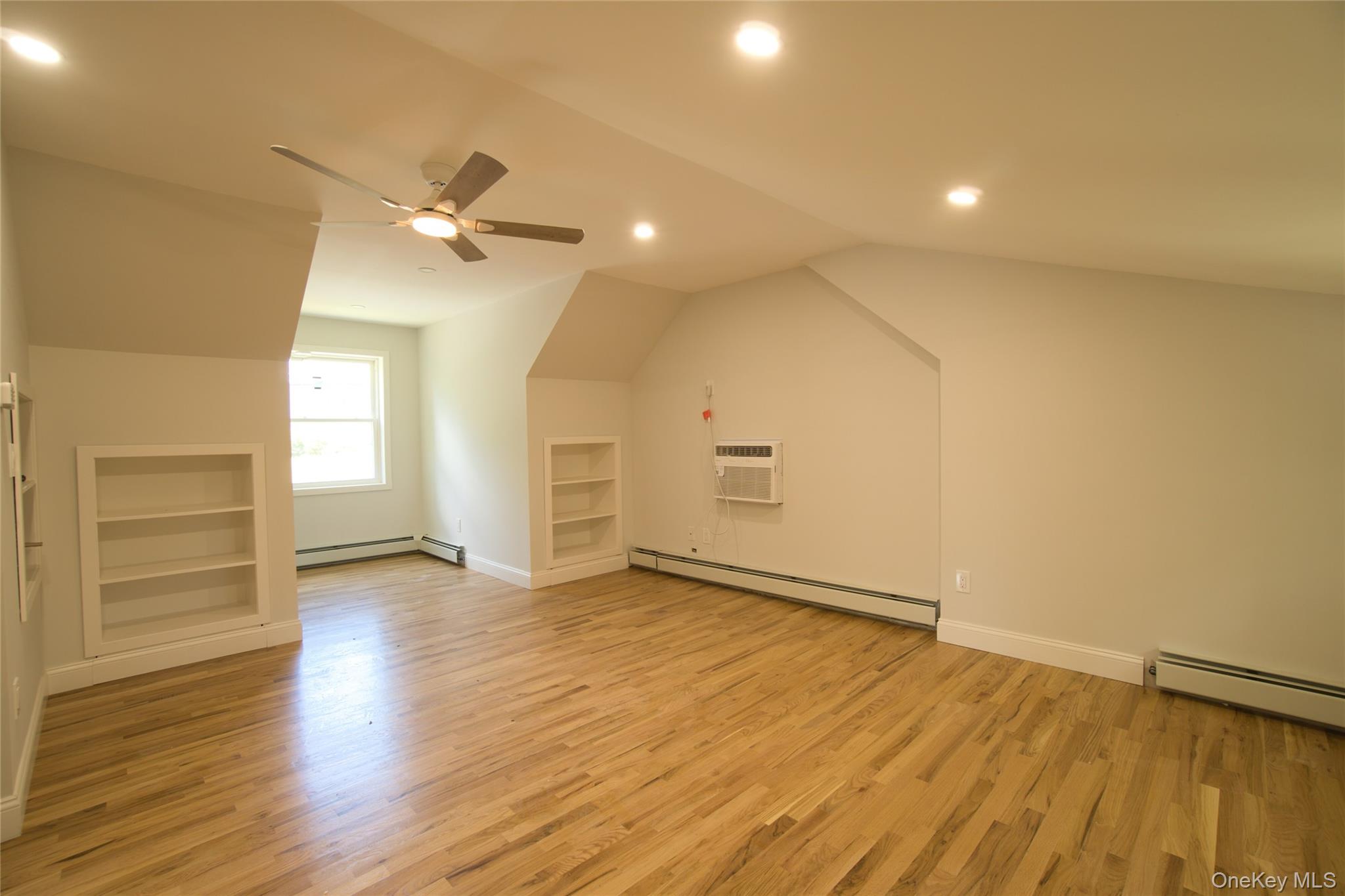 29 Overlin Road Patterson, NY 12563 - Photo 12 of 16 Spacious room featuring wood-finish flooring, recessed lighting, and a ceiling fan