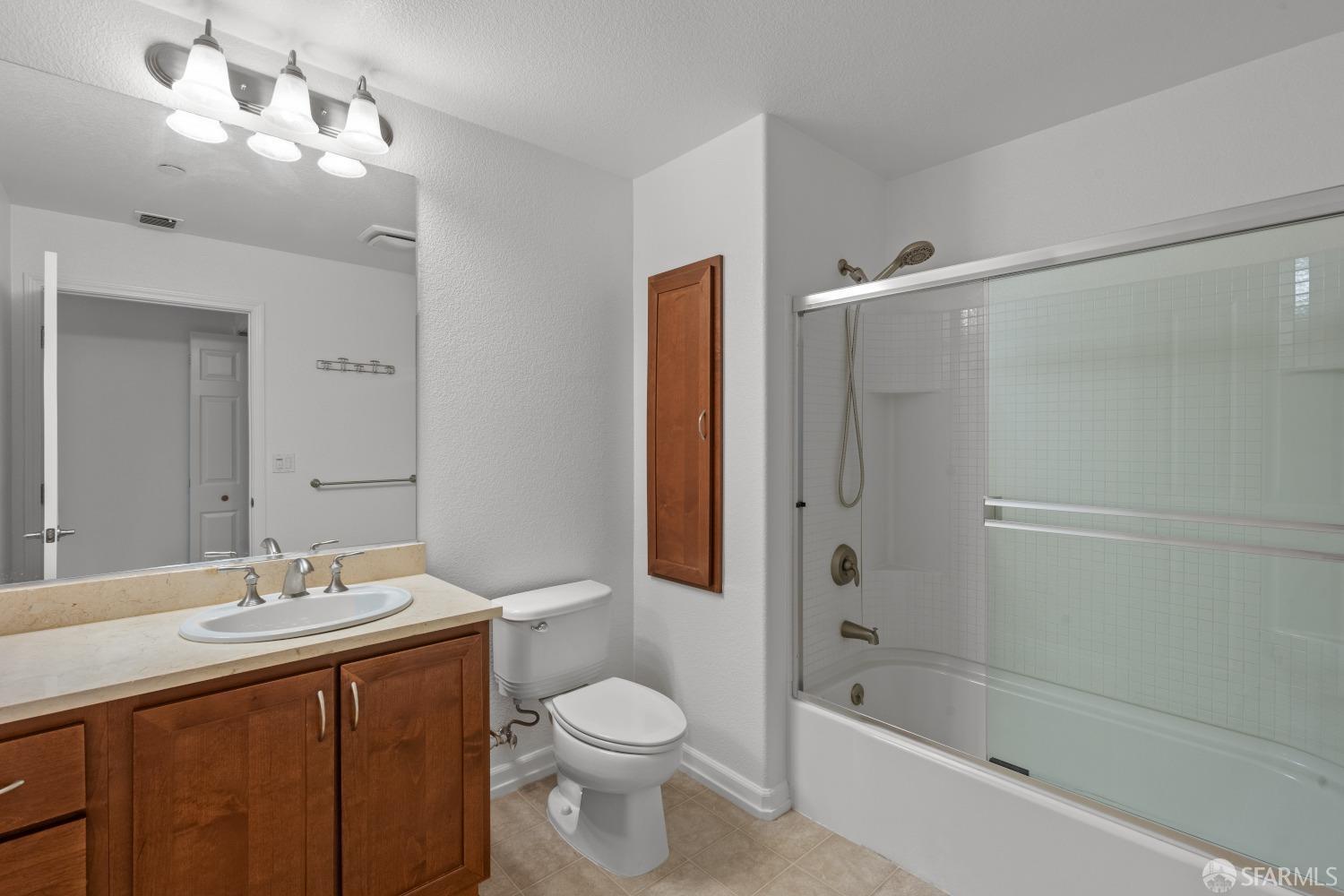 1353 El Camino Real Millbrae, CA 94030 - Photo 19 of 25 a bathroom with a sink a toilet and shower