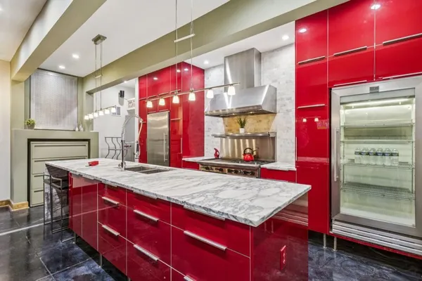 a open kitchen with stainless steel appliances granite countertop a sink and cabinets