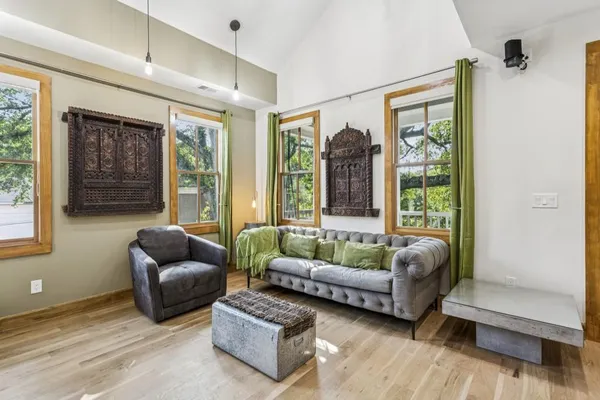 a living room with furniture and a large window