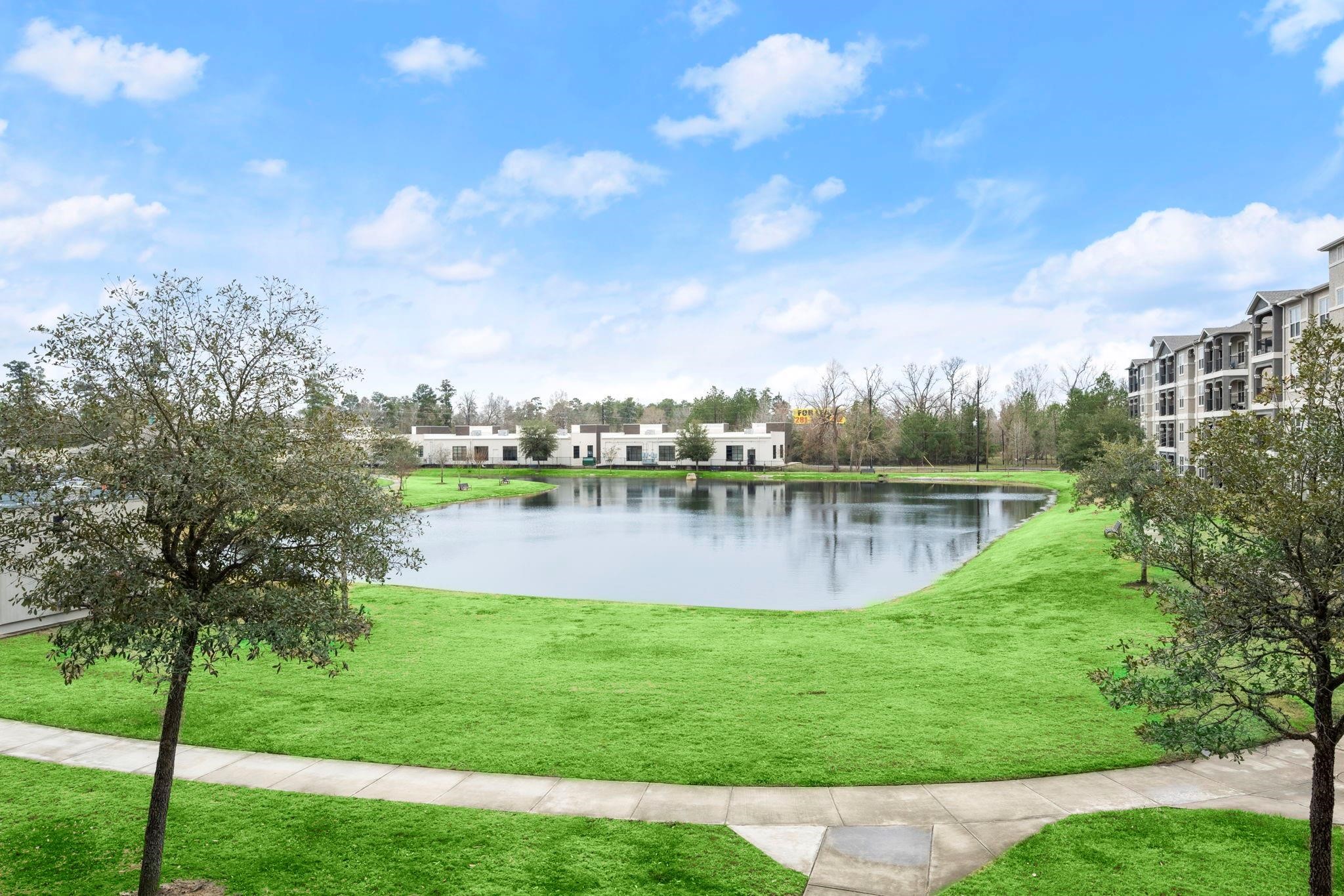 a view of a lake with a big yard