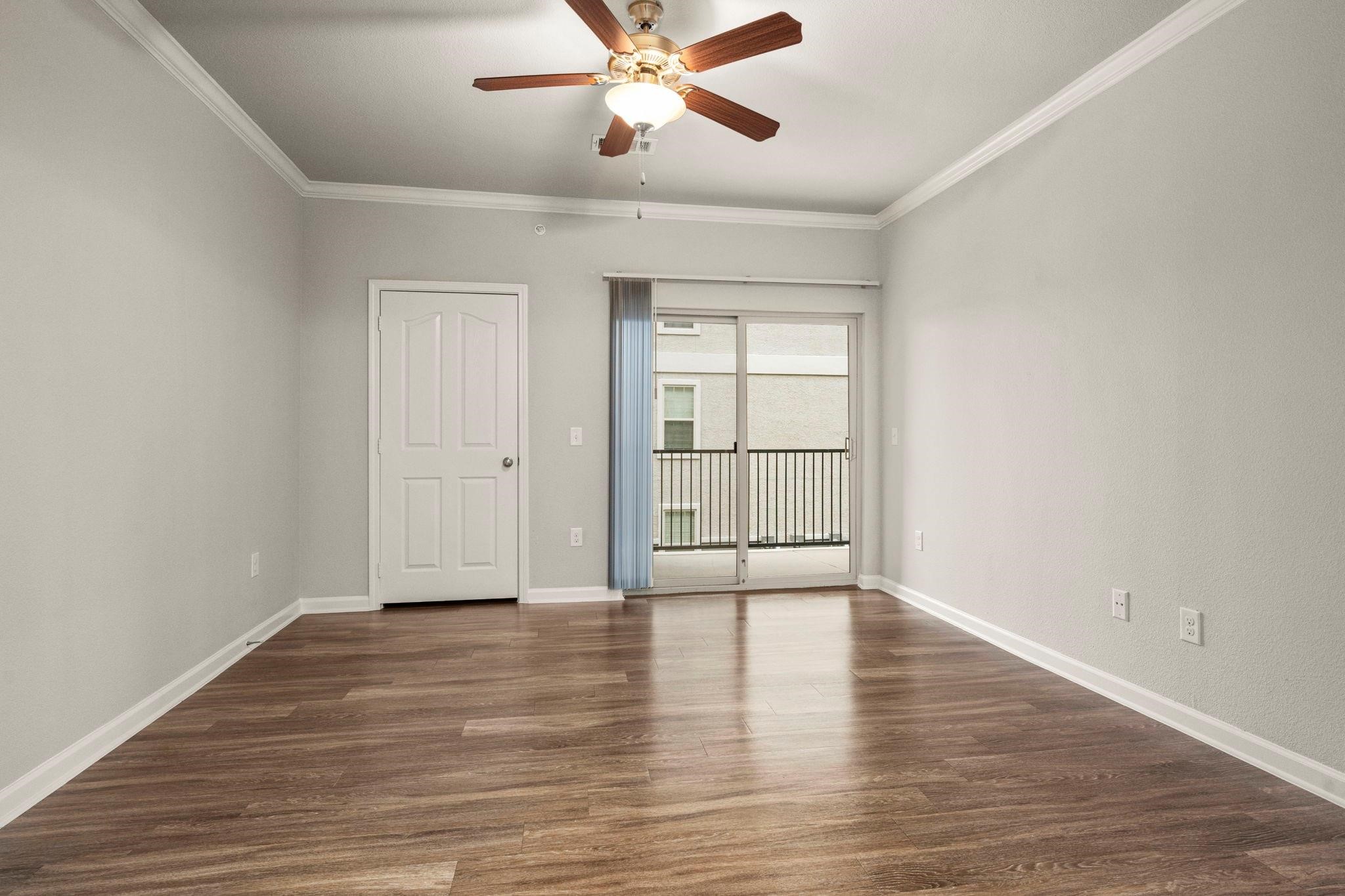 30685 Fm 2978 Road, Unit 4002 Magnolia, TX 77354 - Photo 9 of 16 wooden floor in an empty room with a window
