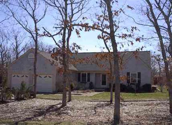 1 Edgewood Drive Edgartown, MA 02539 - Photo 1 of 1 a view of a house with a yard tree and wooden fence