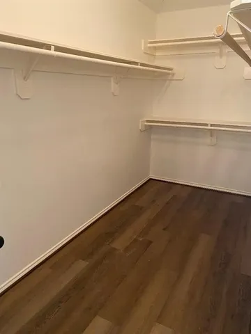 a view of a room with shelf on the wall