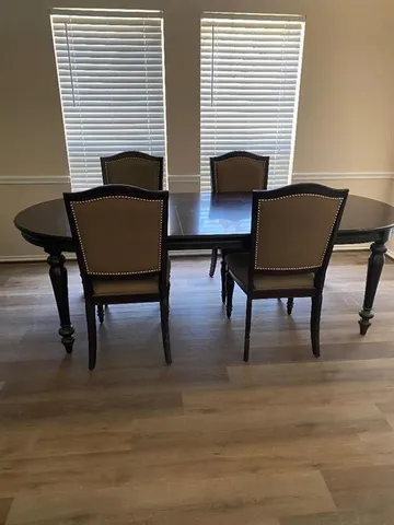 a view of a livingroom with furniture and a kitchen