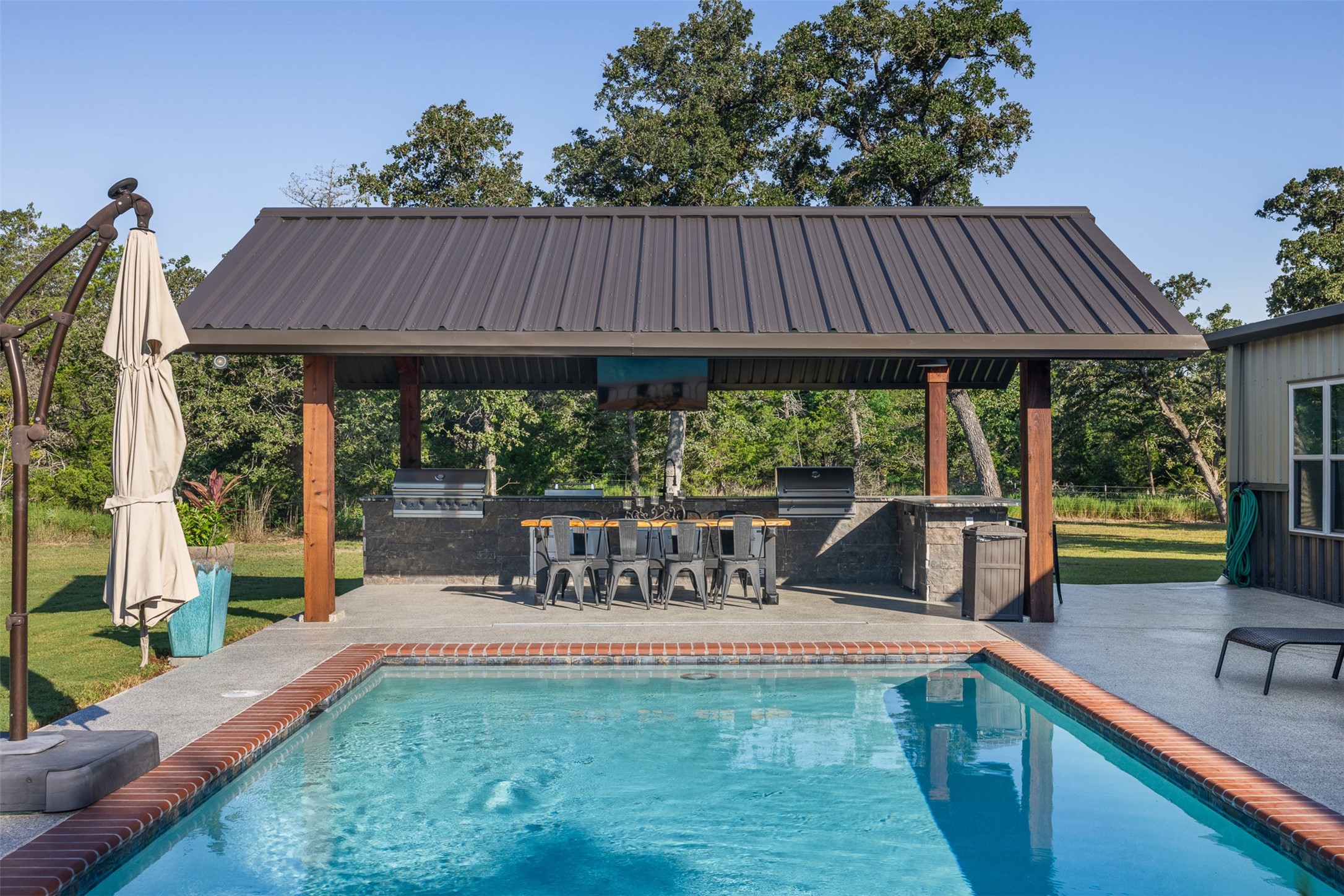 7541 Halamicek Loop Fayetteville, TX 78940 - Photo 12 of 29 a view of a house with porch and wooden floor