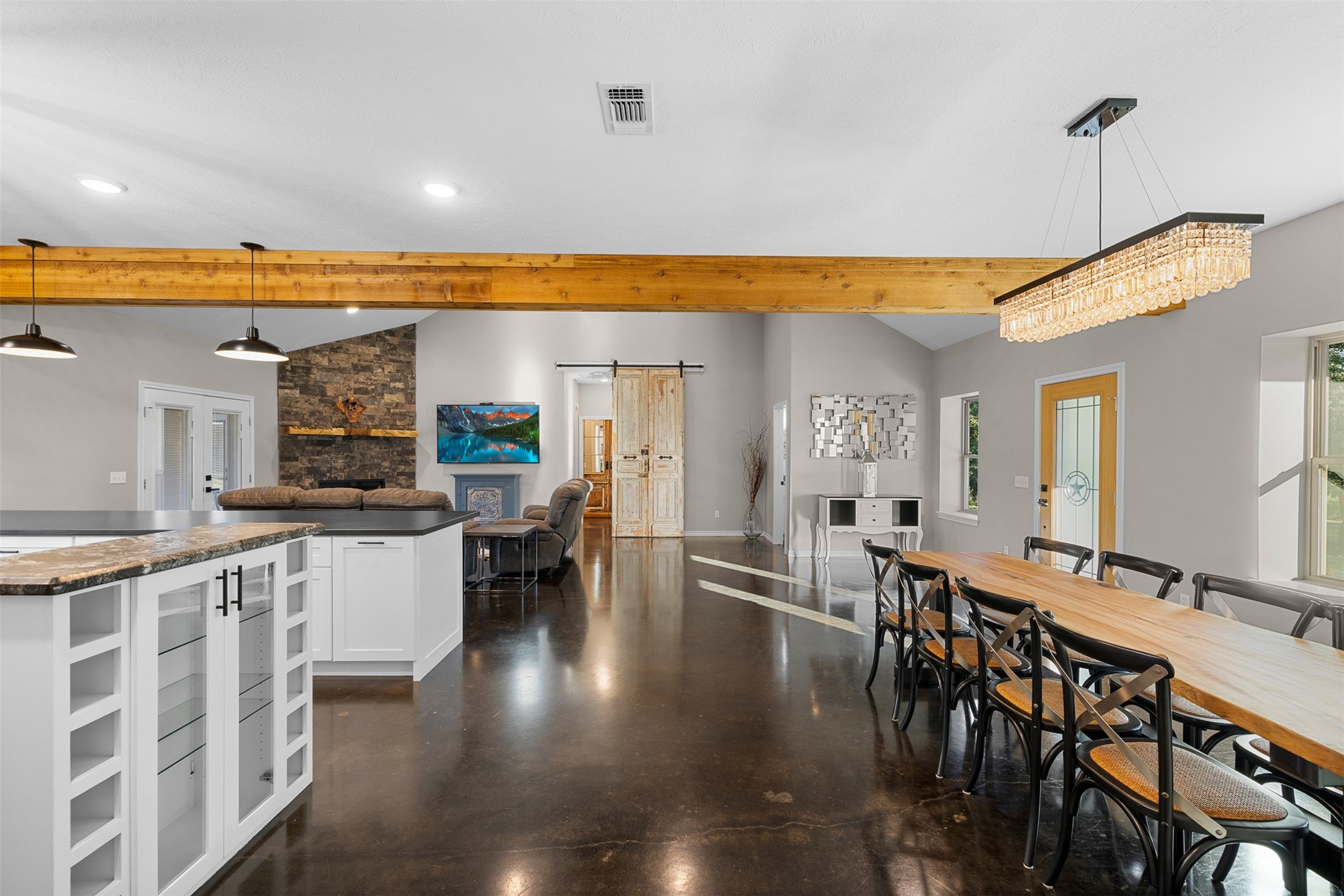 7541 Halamicek Loop Fayetteville, TX 78940 - Photo 17 of 29 a view of a dining room with furniture wooden floor and chandelier