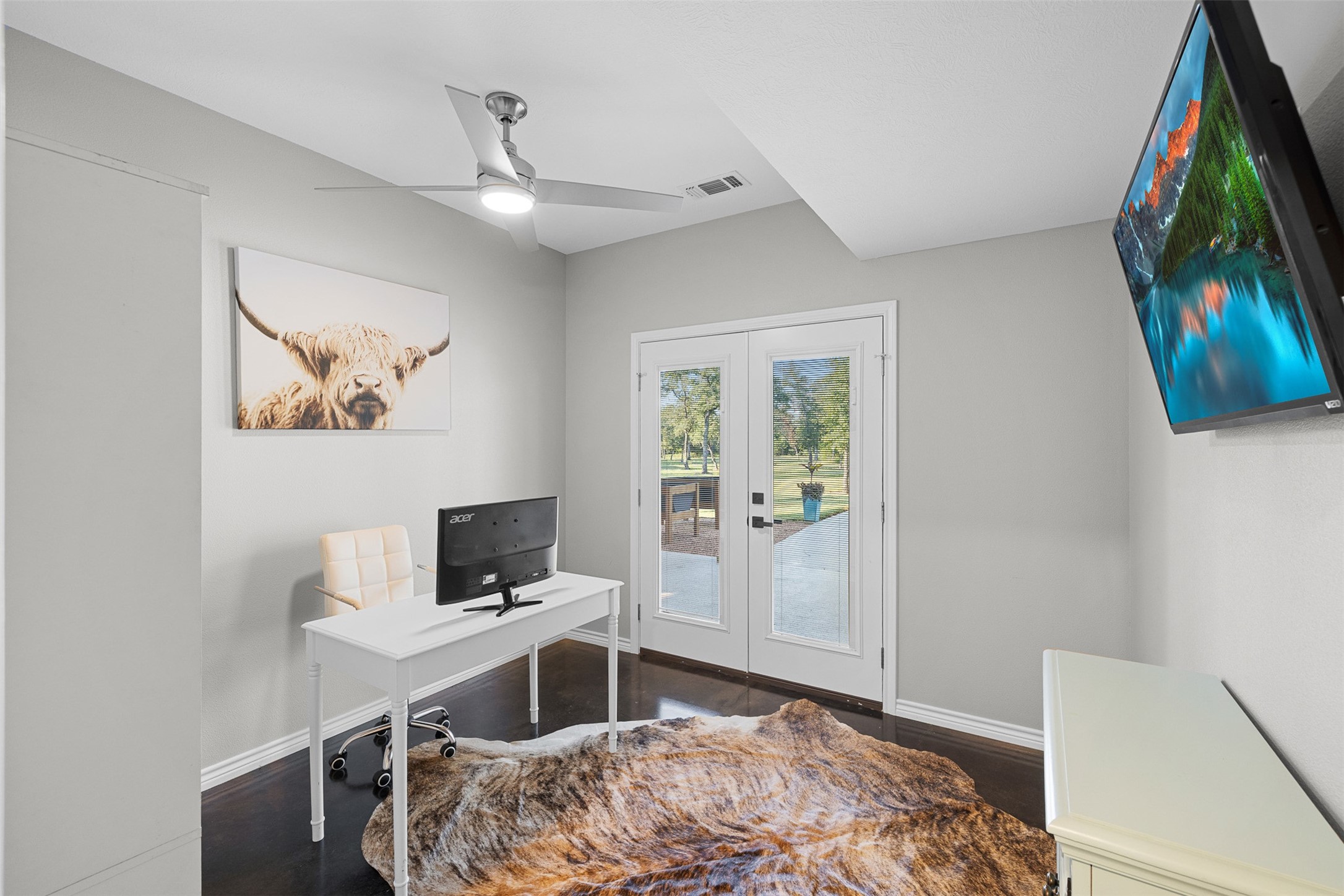 7541 Halamicek Loop Fayetteville, TX 78940 - Photo 18 of 29 a bedroom with a bed and a television