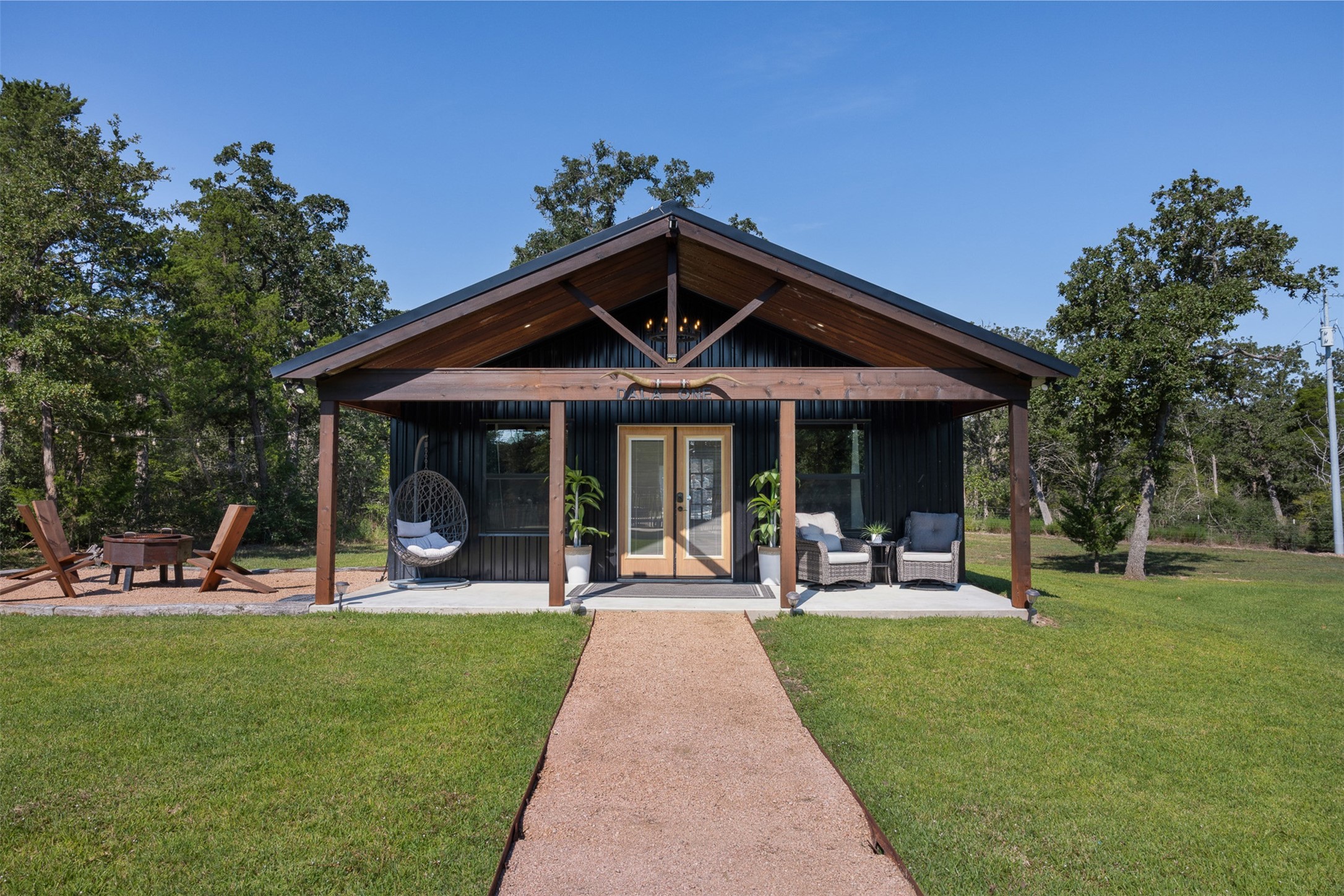 7541 Halamicek Loop Fayetteville, TX 78940 - Photo 5 of 29 a front view of a house with garden and sitting area