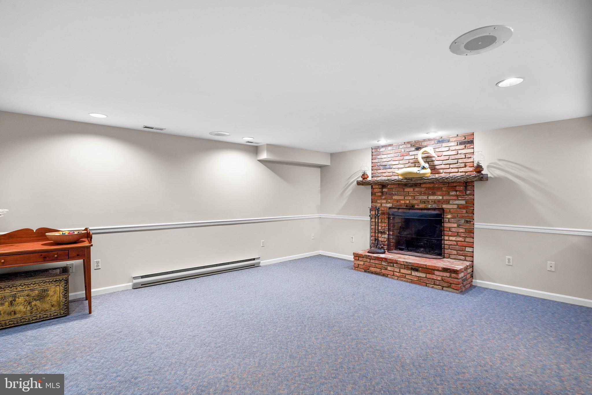 1220 Buckingham Road Arnold, MD 21012 - Photo 27 of 42 Lower level rec room with fireplace