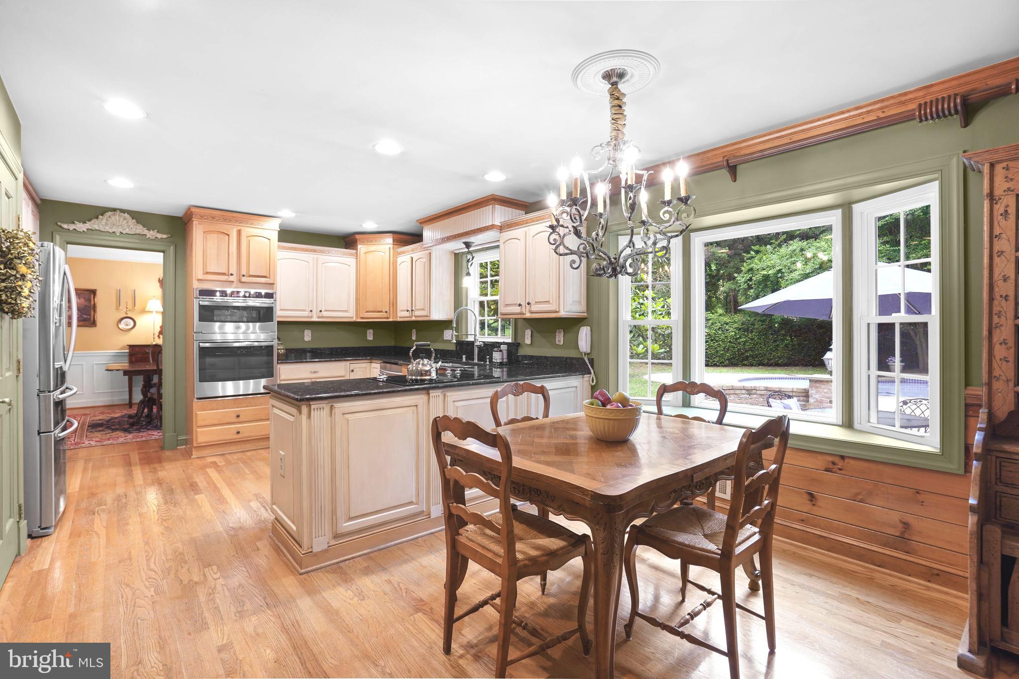 1220 Buckingham Road Arnold, MD 21012 - Photo 10 of 42 Table space connects the family room and kitchen