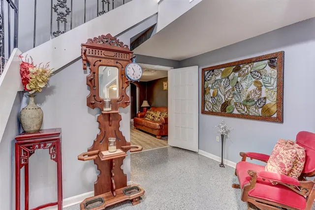 a living room with furniture and a rug
