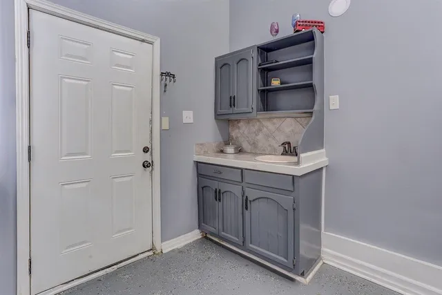 a bathroom with a sink and a mirror