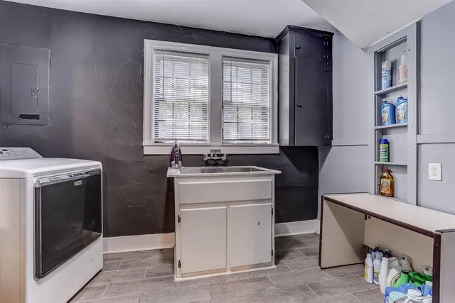 a kitchen with a stove and a sink