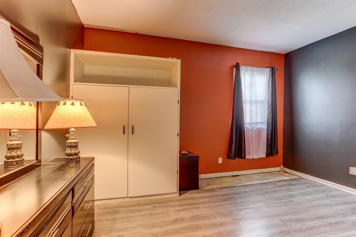 3700 Lakeview Road Memphis, TN 38116 - Photo 22 of 40 an empty room with wooden floor and windows